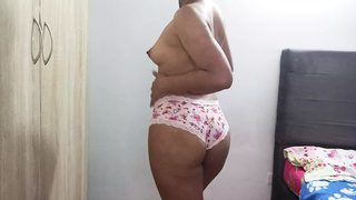 Erotic dance of an 18-year-old girl in her pink panties