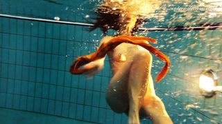 Sexy orange stockings of Markova underwater