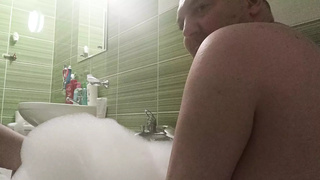 Couple take a bath and he touch her busty body